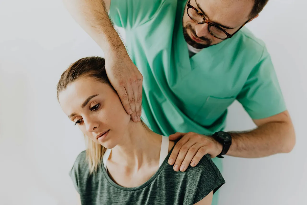 Chiropractor gently adjusting a patient's lower back on a treatment table, illustrating non-surgical pain relief.